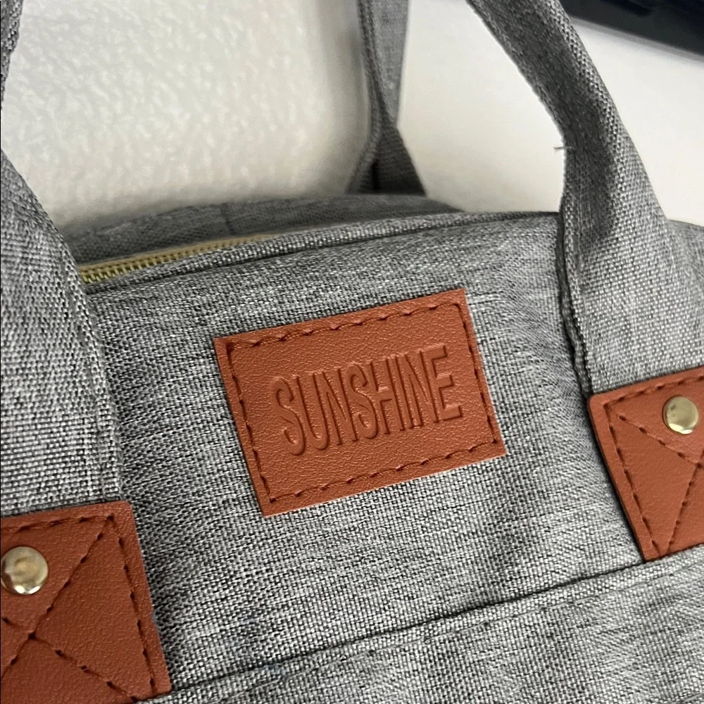 Gray Quilted Backpack with Brown Accents